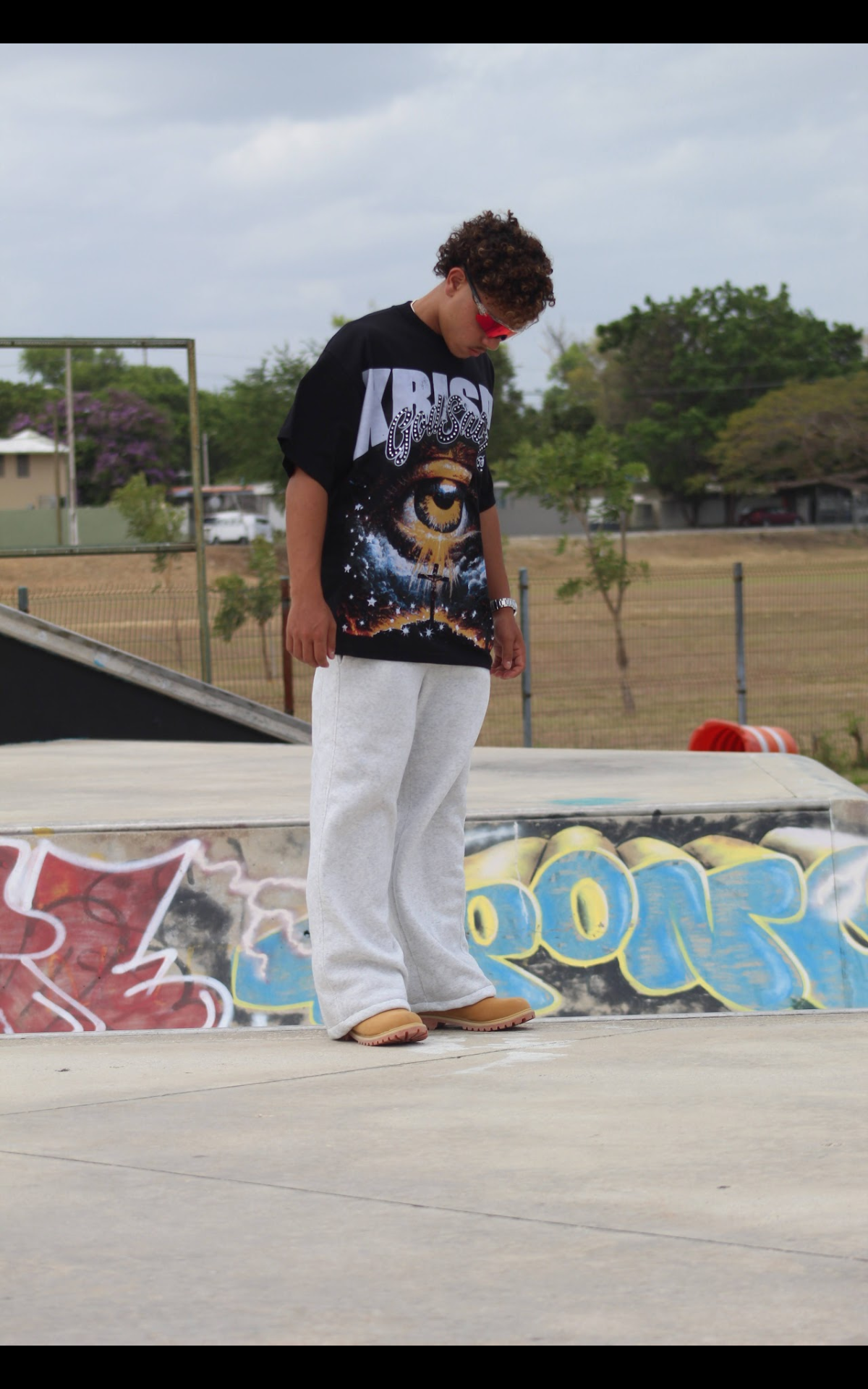 "THROUGH THE EYE OF KRISPY" oversized tee